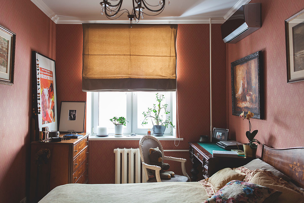 This is an example of a small traditional guest bedroom in Moscow with red walls.