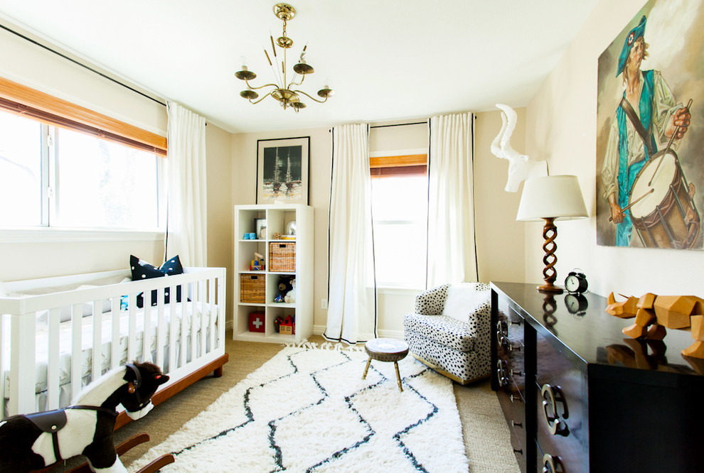 Inspiration for a mid-sized eclectic gender-neutral nursery in Austin with beige walls and carpet.
