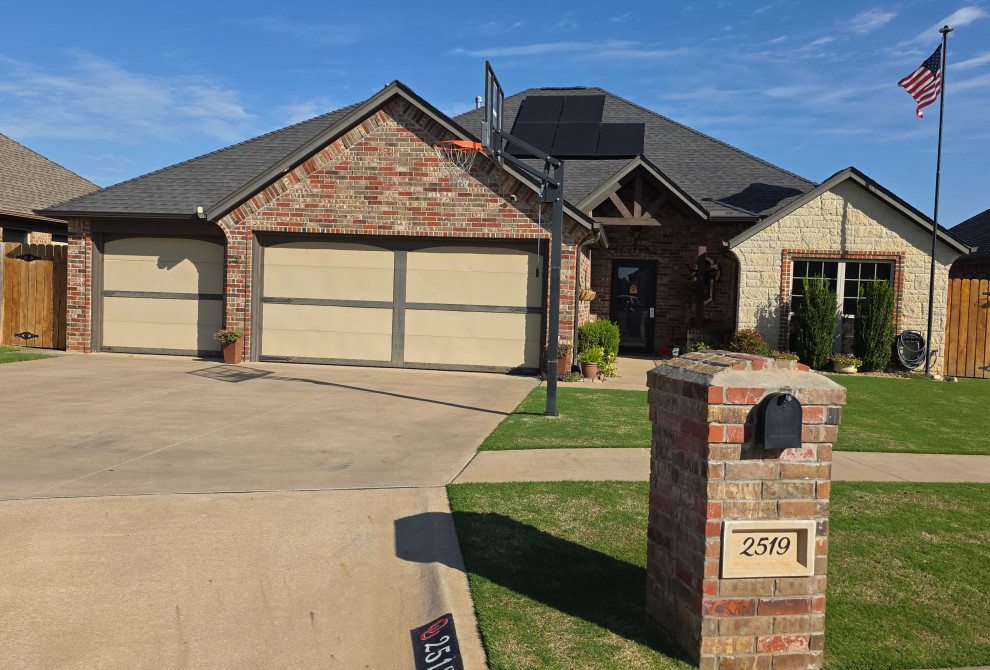 Stone and brick exterior 3 car garage