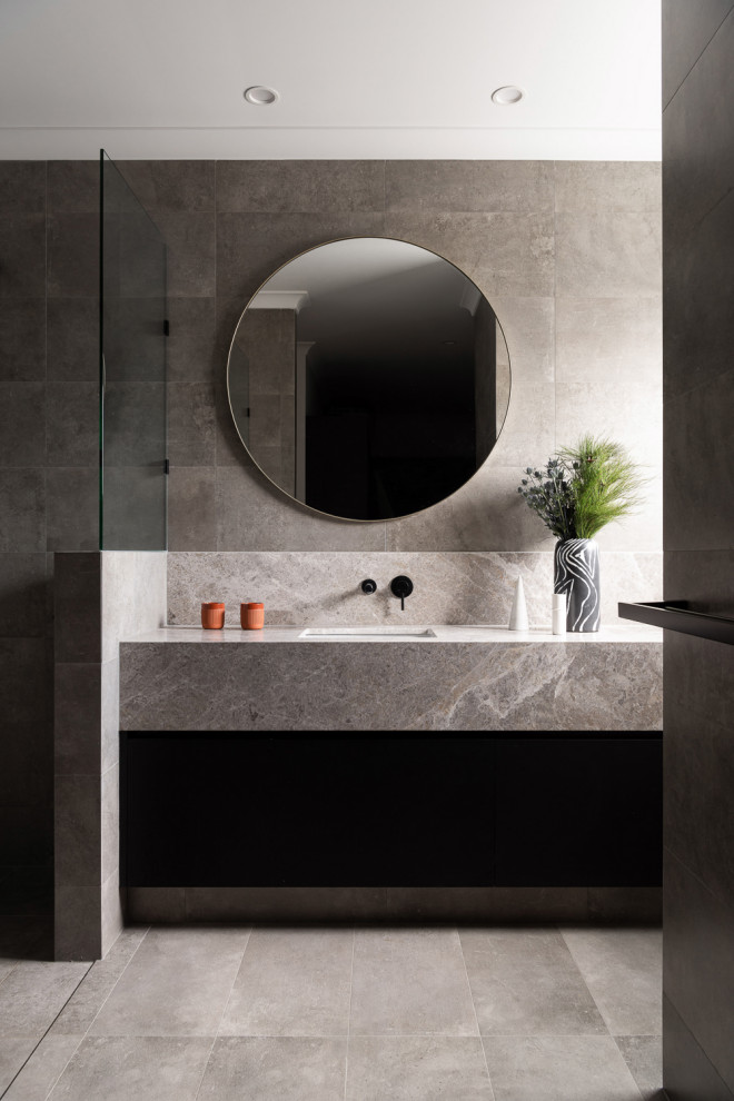 This is an example of a mid-sized modern master bathroom in Perth with black cabinets, gray tile, porcelain tile, porcelain floors, an undermount sink, marble benchtops, grey floor, grey benchtops, a single vanity, a curbless shower, an open shower and a built-in vanity.