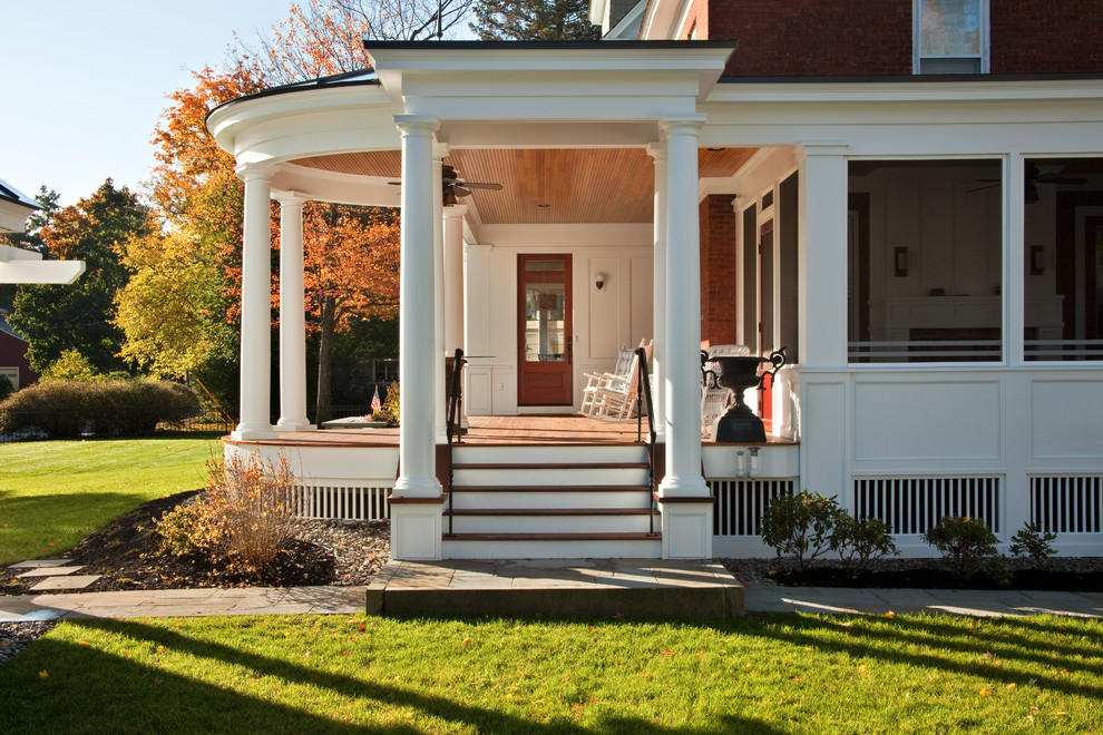 Mid-sized traditional side yard screened-in verandah in Boston with a roof extension.