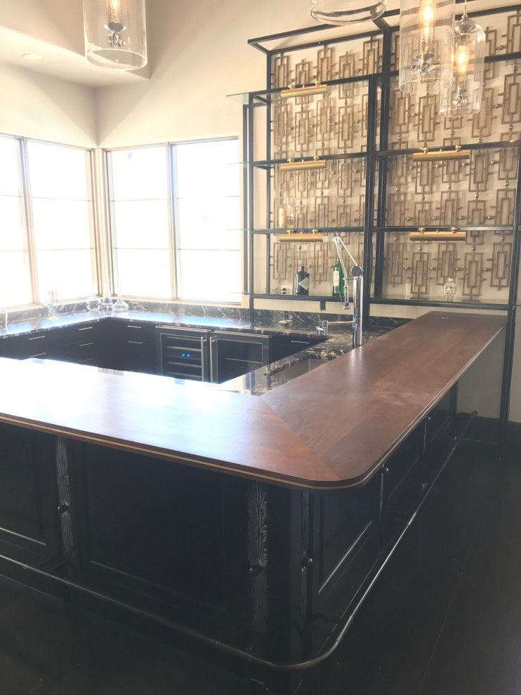 Design ideas for a mid-sized midcentury l-shaped seated home bar in Austin with an integrated sink, wood benchtops, grey splashback, glass tile splashback and brown benchtop.