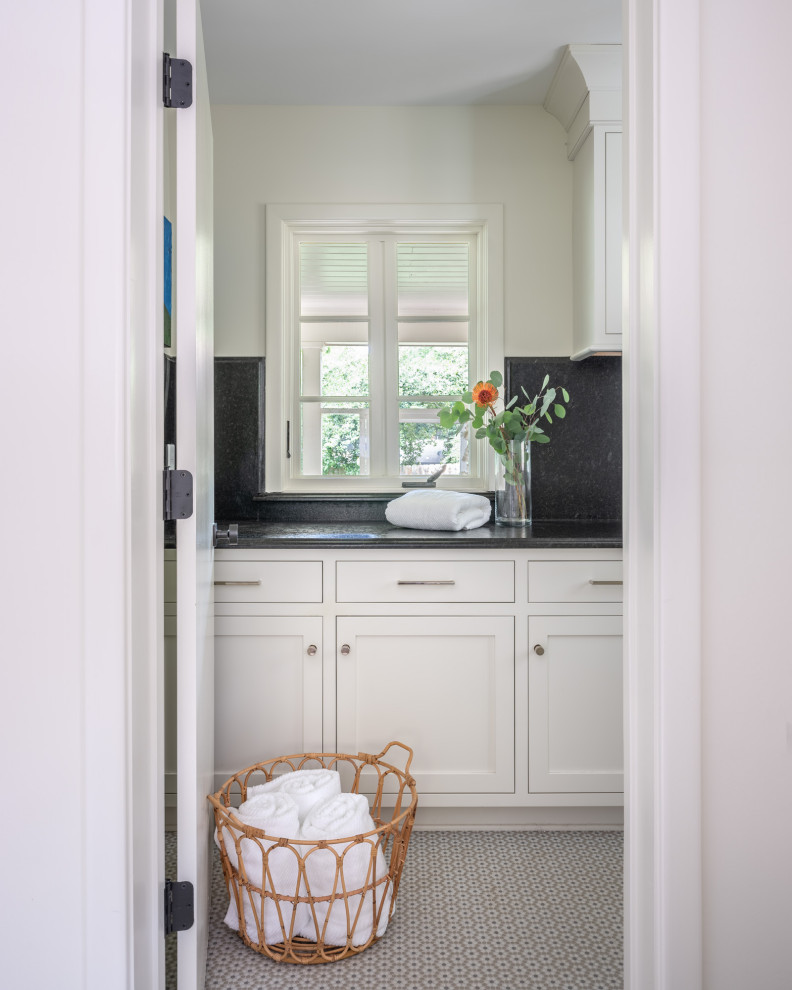Mid-sized transitional u-shaped cement tile floor and gray floor eat-in kitchen photo with a drop-in sink, shaker cabinets, white cabinets, quartzite countertops, gray backsplash, porcelain backsplash, stainless steel appliances, an island and multicolored countertops