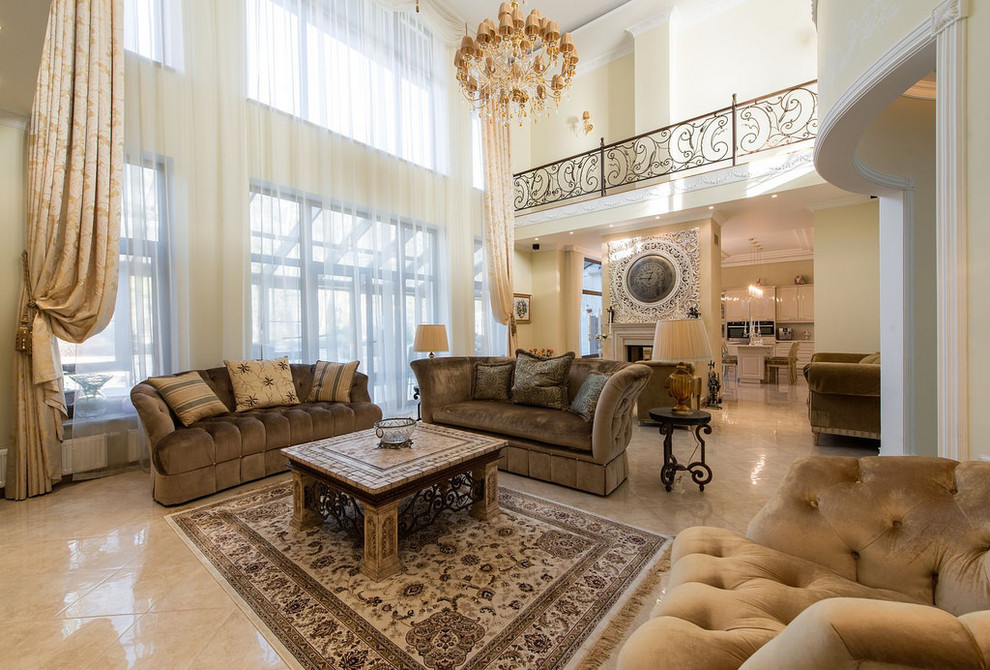 This is an example of an expansive transitional open concept living room in Moscow with a home bar, beige walls, porcelain floors, a two-sided fireplace, a plaster fireplace surround, a wall-mounted tv and beige floor.