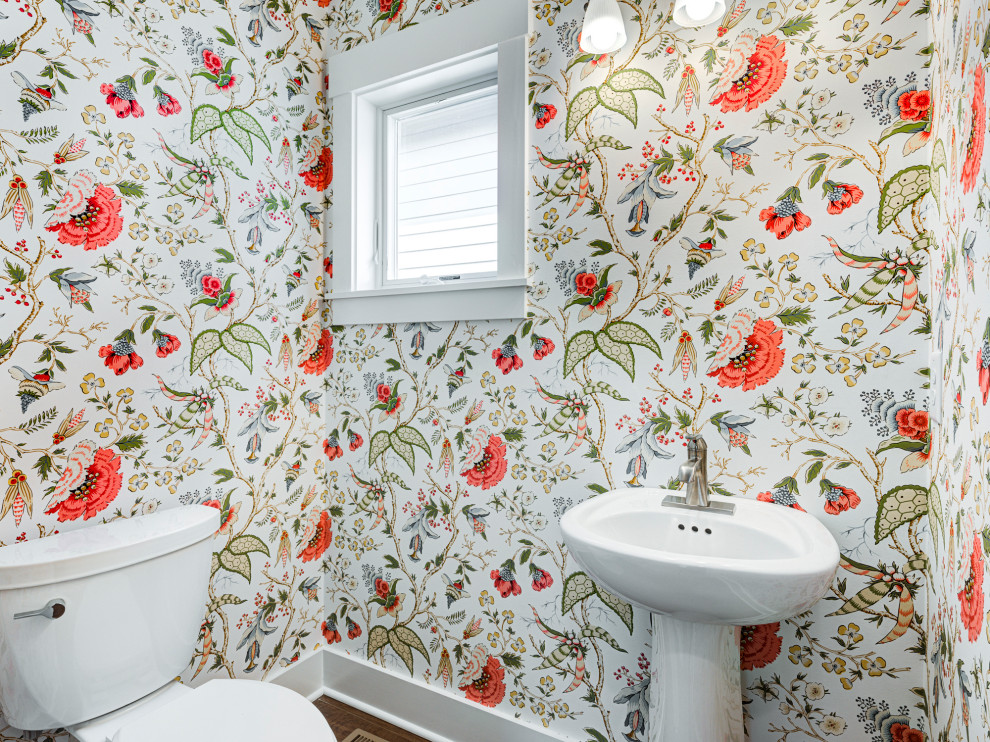 This is an example of a small traditional cloakroom in Indianapolis with a freestanding vanity unit and wallpapered walls.