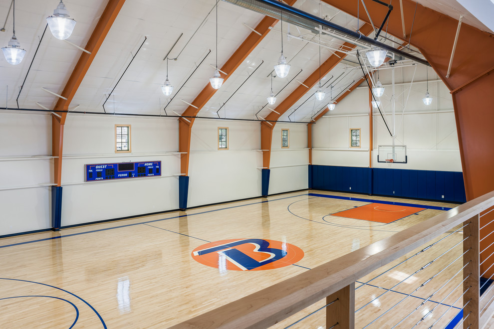 Photo of an expansive transitional indoor sport court in Philadelphia with white walls and light hardwood floors.