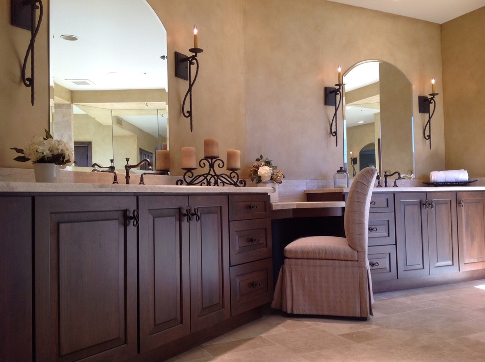 Inspiration for a large transitional master bathroom in Phoenix with a trough sink, raised-panel cabinets, marble benchtops, a freestanding tub, a curbless shower, beige tile, stone tile and travertine floors.