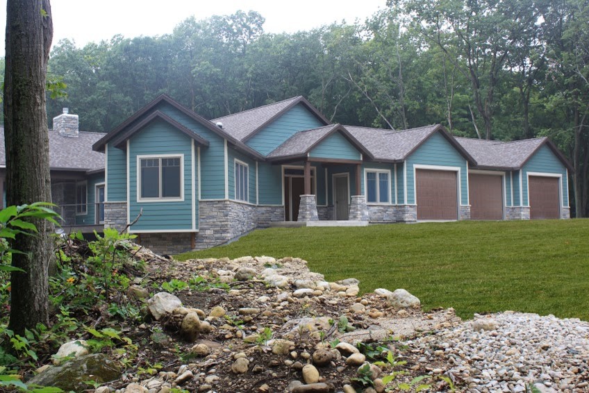 Example of a large minimalist blue two-story wood exterior home design
