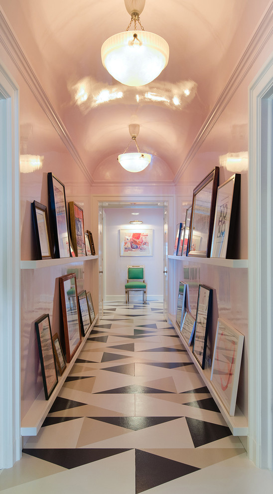 Large eclectic hallway in Chicago with pink walls and multi-coloured floor.