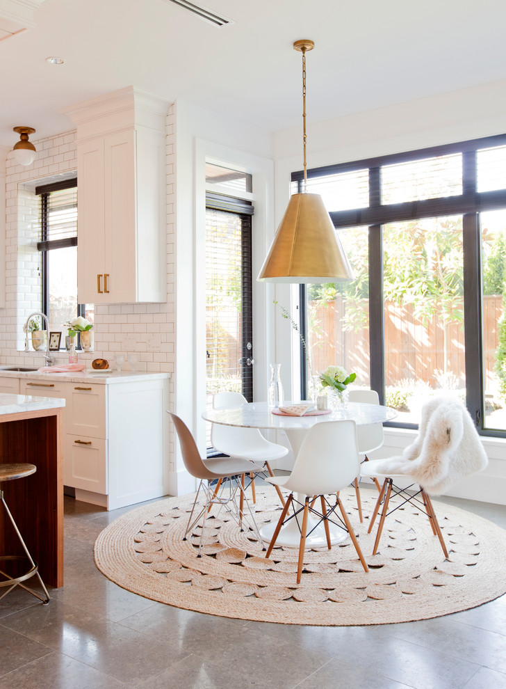 Mid-sized transitional concrete floor and gray floor great room photo in Vancouver with white walls and no fireplace