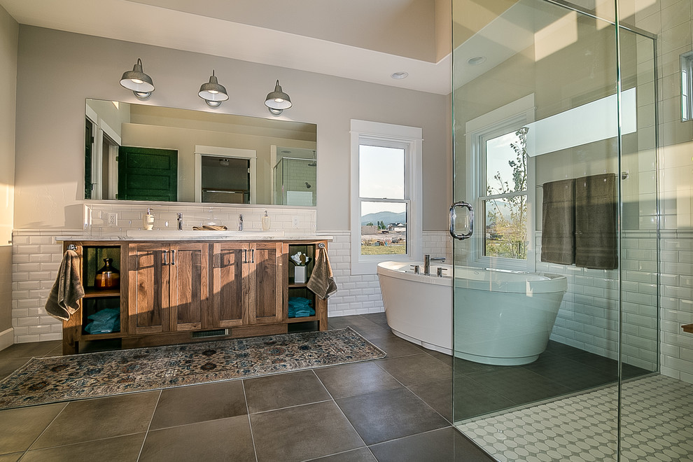 Large country master bathroom in Other with beaded inset cabinets, grey cabinets, grey walls, an undermount sink, engineered quartz benchtops, white benchtops, a freestanding tub, a curbless shower, white tile, subway tile, ceramic floors, brown floor and a hinged shower door.