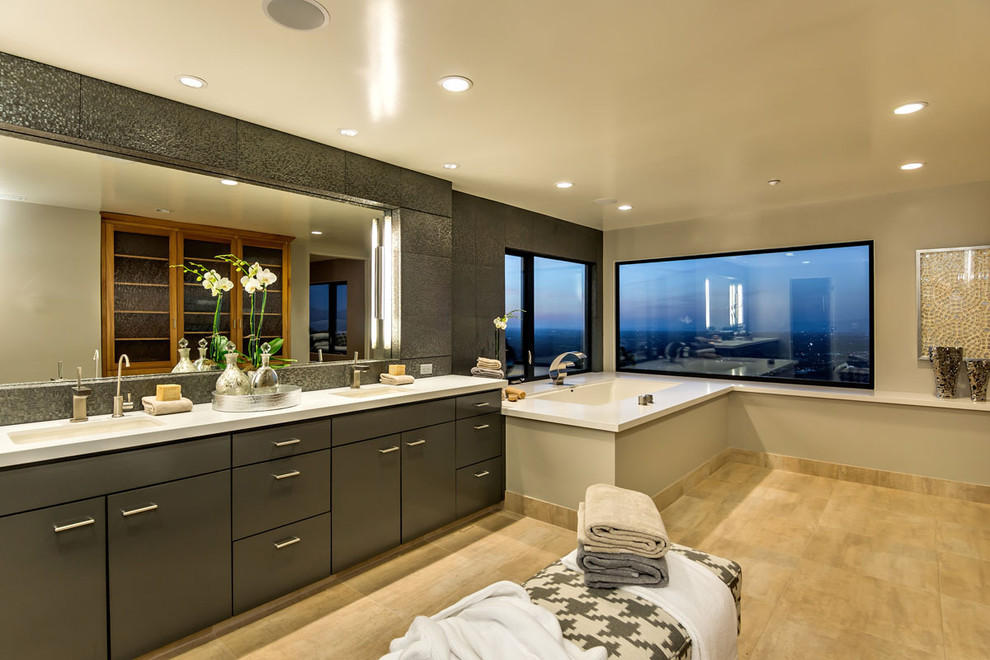 This is an example of a large modern master bathroom in San Francisco with grey cabinets, flat-panel cabinets, an alcove tub, grey walls, porcelain floors, an undermount sink and engineered quartz benchtops.