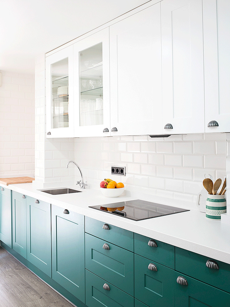 Inspiration for a mid-sized industrial single-wall separate kitchen in Madrid with wood benchtops, white splashback, plywood floors, a single-bowl sink, recessed-panel cabinets, green cabinets, subway tile splashback and no island.