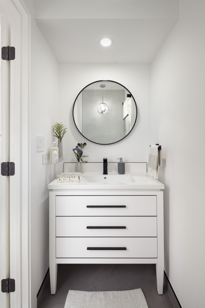 Powder room - large mid-century modern porcelain tile and gray floor powder room idea in San Francisco with flat-panel cabinets, gray cabinets, a wall-mount toilet, white walls, an undermount sink, quartzite countertops, white countertops and a freestanding vanity