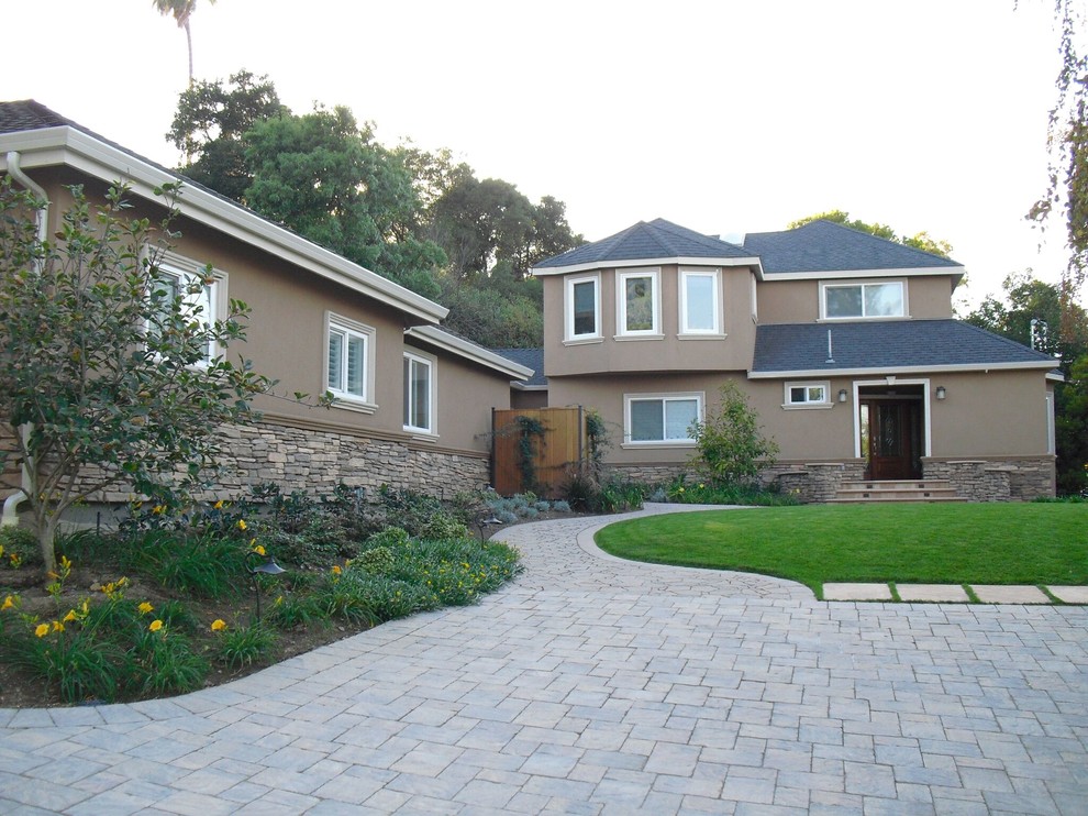 Photo of a large contemporary two-storey stucco beige exterior in San Francisco with a hip roof.
