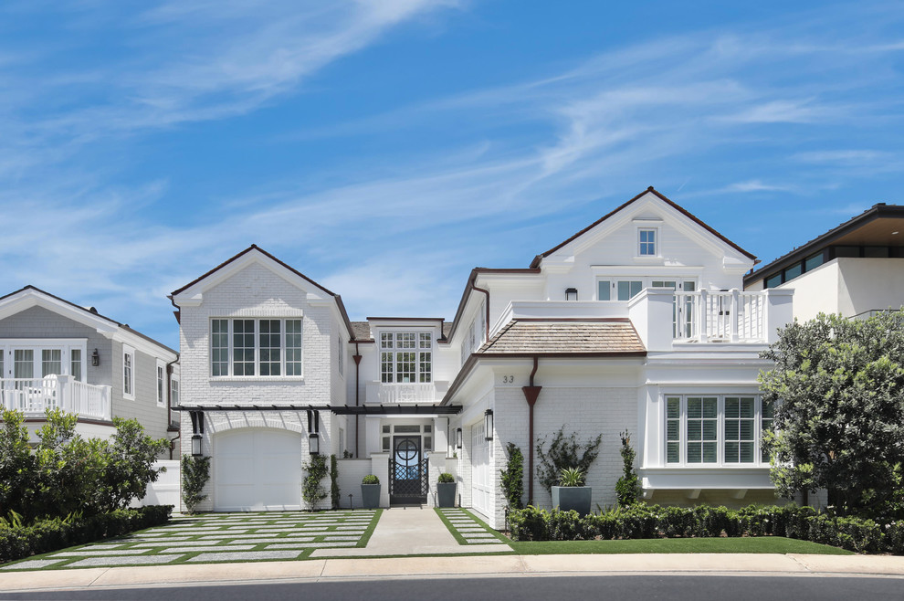 Example of a beach style home design design in Orange County