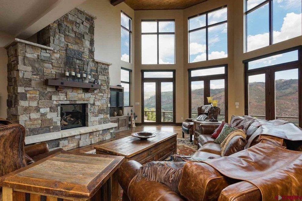 Example of a mountain style home design design in Phoenix