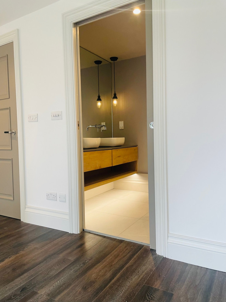Master Ensuite with Eclisse pocket door , custom made oak vanity unit