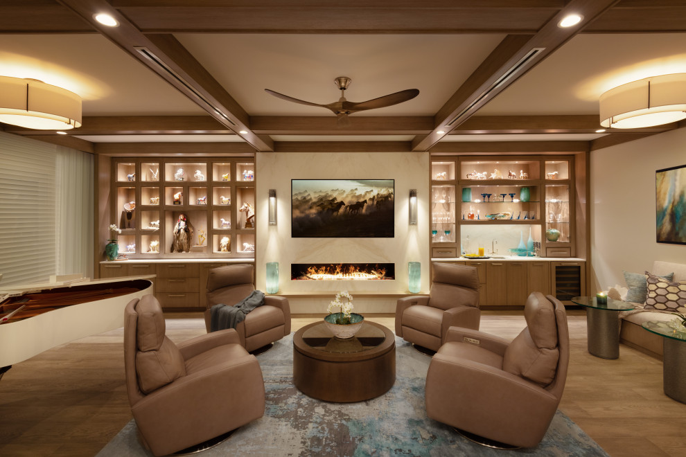 Large beach style open concept living room with a music area, white walls, medium hardwood floors, a standard fireplace, a stone fireplace surround, a built-in media wall, coffered and wallpaper.