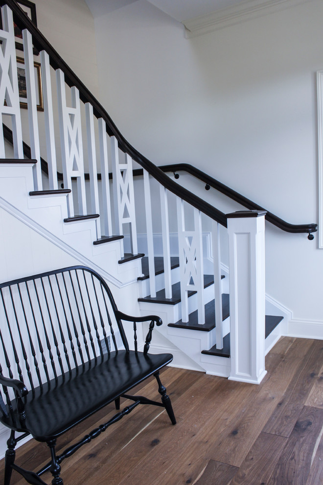 Small country wood l-shaped staircase in DC Metro with wood risers and wood railing.