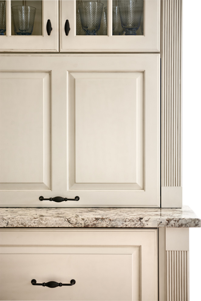 Inspiration for a traditional kitchen in Philadelphia with raised-panel cabinets and white cabinets.