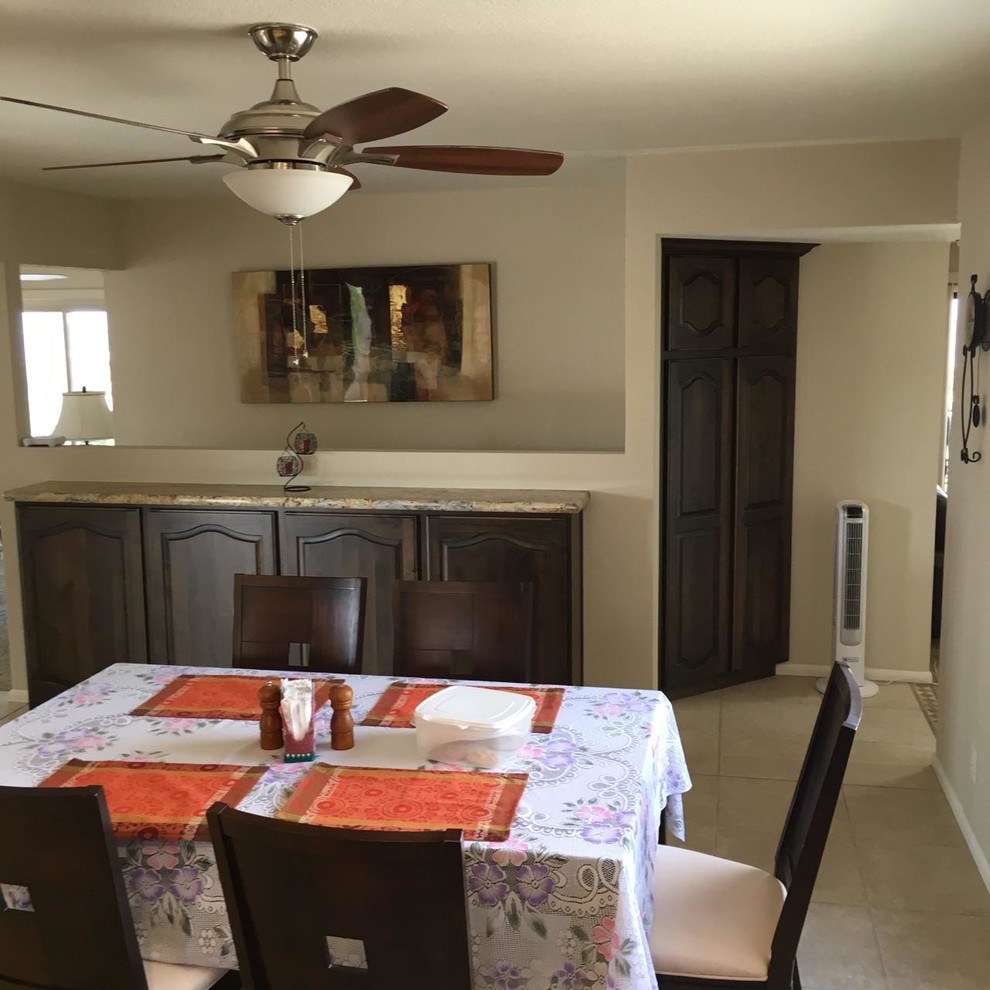 Example of a small transitional u-shaped eat-in kitchen design in Phoenix with a drop-in sink, beaded inset cabinets, dark wood cabinets, granite countertops, stone tile backsplash, stainless steel appliances and no island