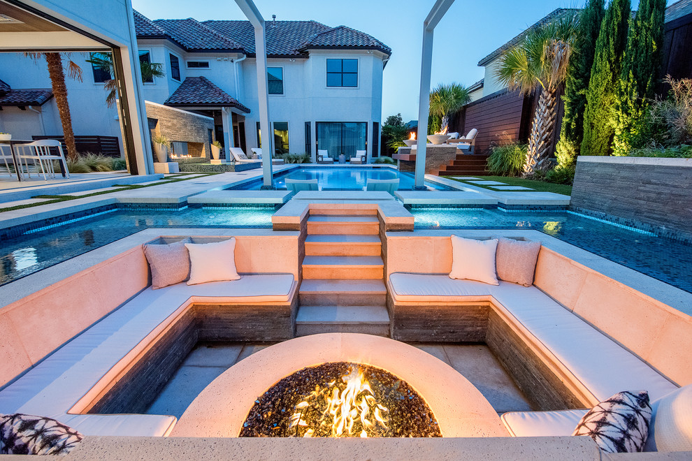 Design ideas for a large mediterranean courtyard custom-shaped pool in Dallas with concrete pavers.