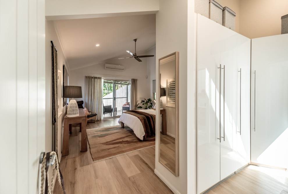 Photo of a medium sized contemporary master bedroom in Sunshine Coast with vinyl flooring.