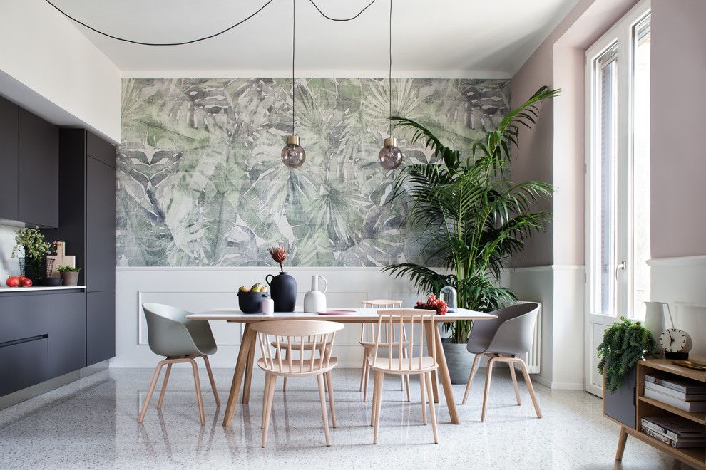Photo of a transitional dining room in Milan with pink walls and white floor.
