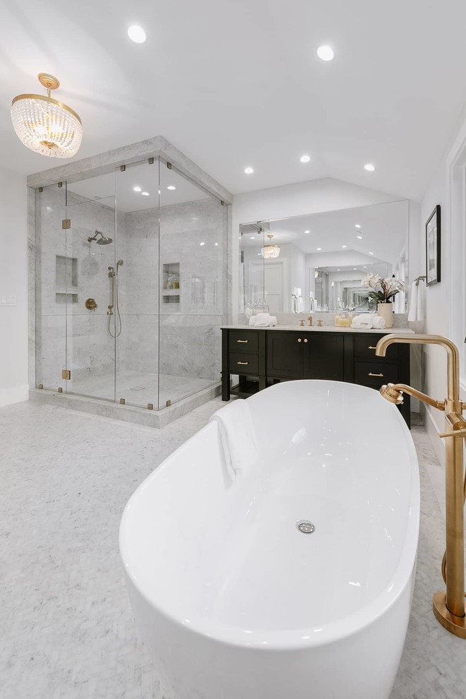 Photo of a mid-sized country bathroom in Los Angeles with furniture-like cabinets, brown cabinets, a freestanding tub, an alcove shower, white walls, mosaic tile floors, an undermount sink, quartzite benchtops, grey floor, a hinged shower door and white benchtops.