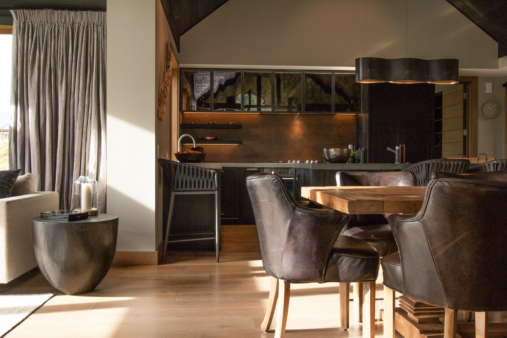 This is an example of a Mid-sized country dining room in Auckland With Beige Walls, Medium Hardwood Floors, No Fireplace and Beige Floor.