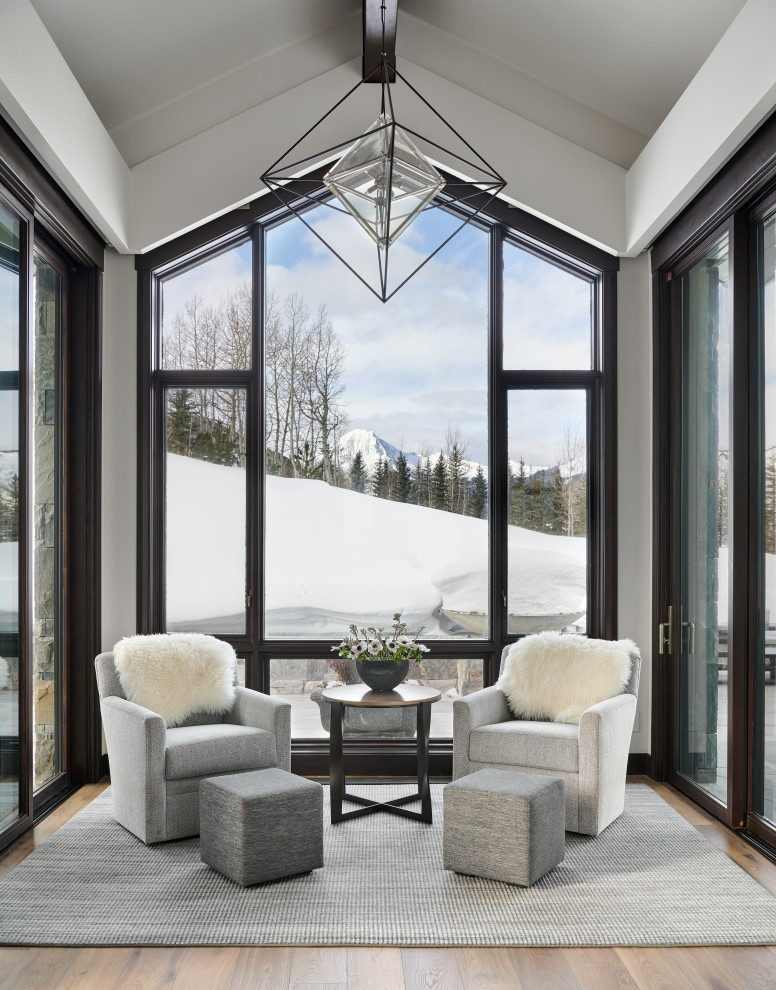 Example of a mountain style home design design in Denver
