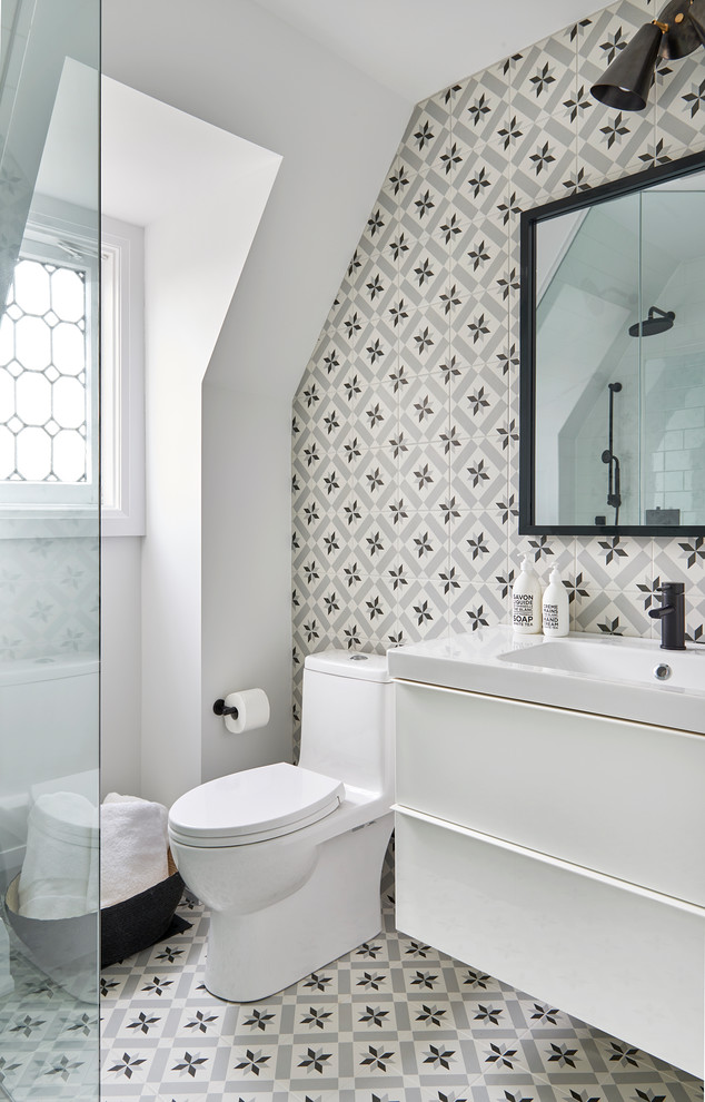 Bathroom - transitional black and white tile cement tile floor and multicolored floor bathroom idea in Toronto with flat-panel cabinets, white cabinets, white walls and a console sink