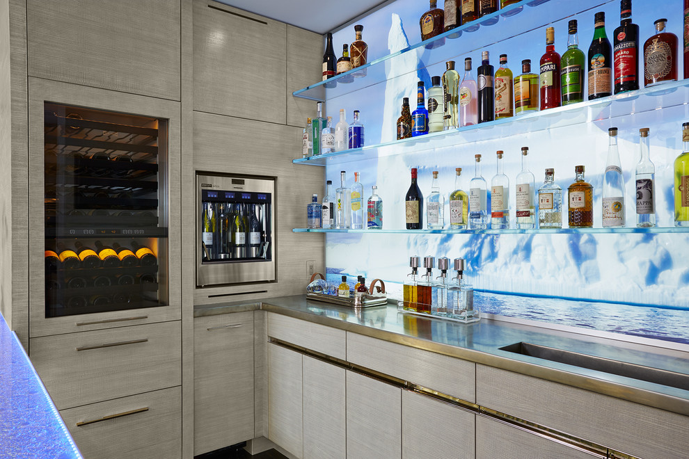 Inspiration for a mid-sized transitional galley seated home bar in Minneapolis with an integrated sink, flat-panel cabinets, grey cabinets, zinc benchtops and glass sheet splashback.