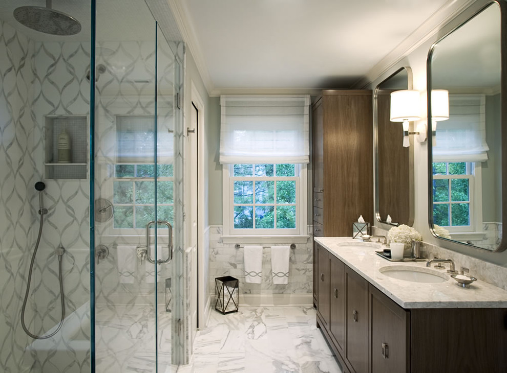 Photo of a contemporary bathroom in New York with an undermount sink, shaker cabinets, dark wood cabinets, marble benchtops, a freestanding tub, an open shower, a two-piece toilet, white tile, a hinged shower door and marble.