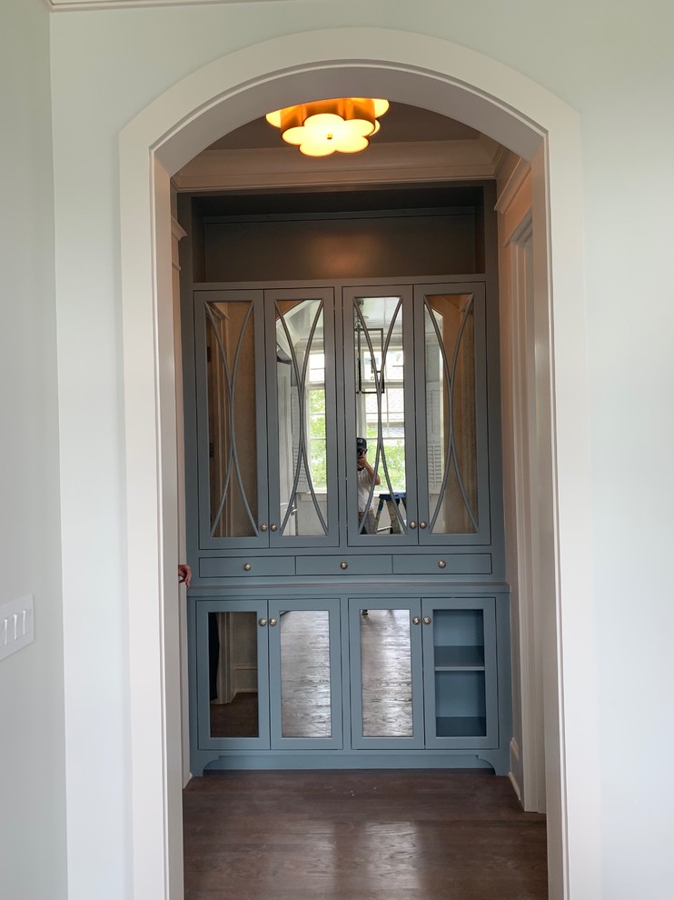 mirrored linen in vestibule off of master bath.
