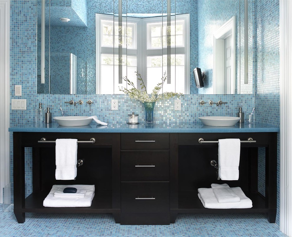 Elegant master brown tile and mosaic tile mosaic tile floor bathroom photo in New York with a vessel sink, flat-panel cabinets, dark wood cabinets, marble countertops and blue walls