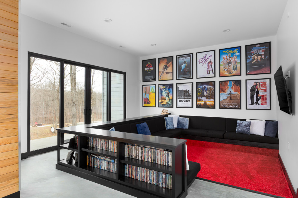 Inspiration for a medium sized contemporary open plan games room in St Louis with white walls, carpet, no fireplace, a wall mounted tv and red floors.