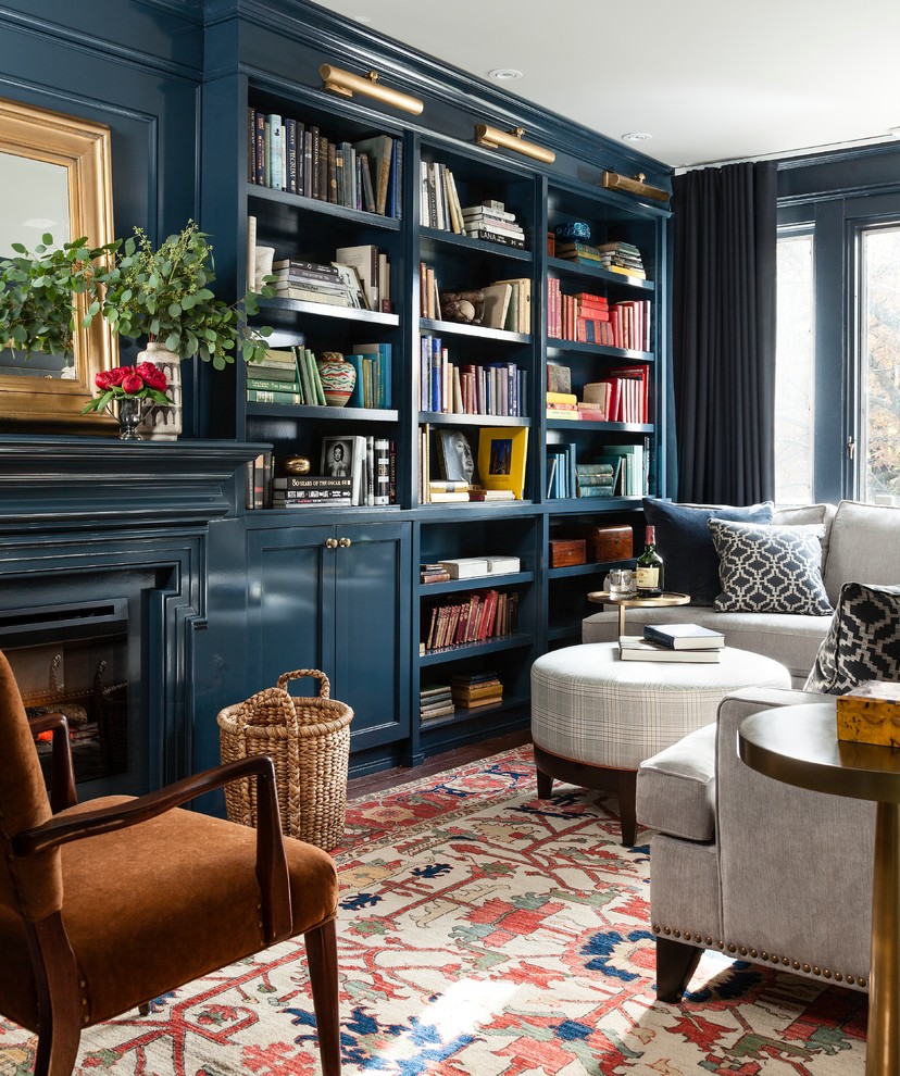 Inspiration for a small traditional family room in Toronto with blue walls, a standard fireplace and carpet.
