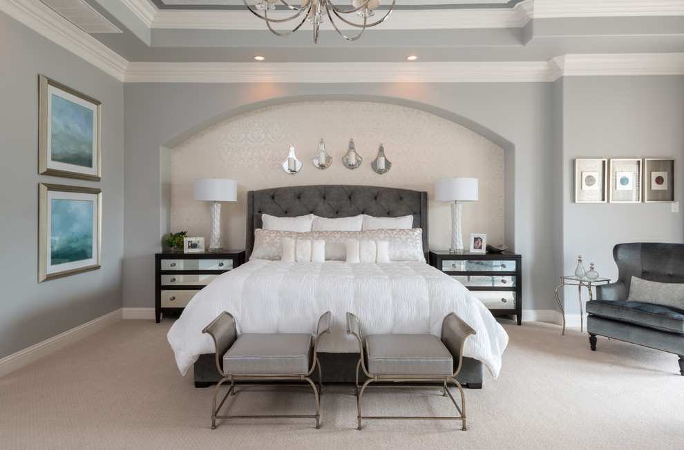 Transitional bedroom in New Orleans with grey walls, carpet and beige floor.