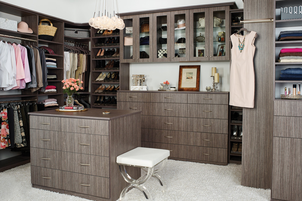 Photo of a large country gender-neutral walk-in wardrobe in Philadelphia with flat-panel cabinets, dark wood cabinets, carpet and white floor.