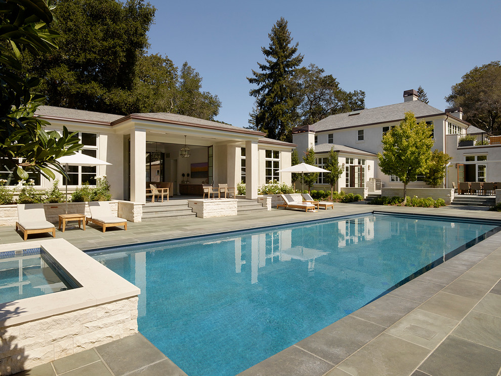 Huge transitional backyard stone and rectangular lap pool house photo in San Francisco