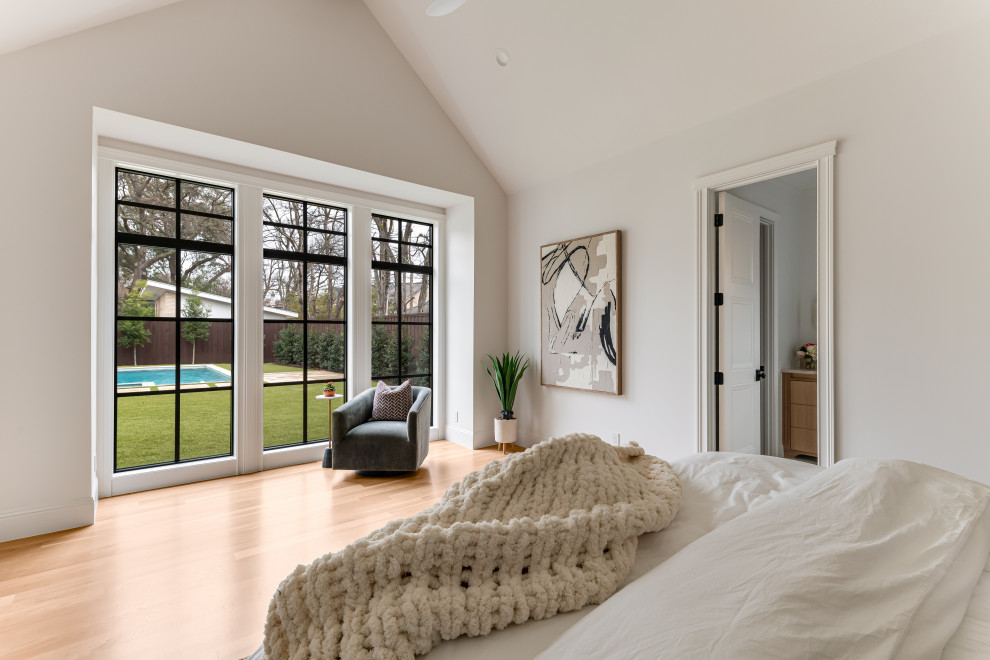 Example of a transitional bedroom design in Dallas