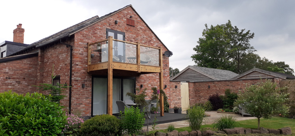 Design ideas for a country wood railing balcony in Cheshire.