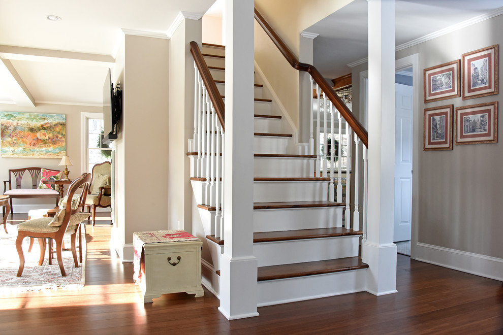 Design ideas for a mid-sized transitional wood straight staircase in Providence with painted wood risers and wood railing.
