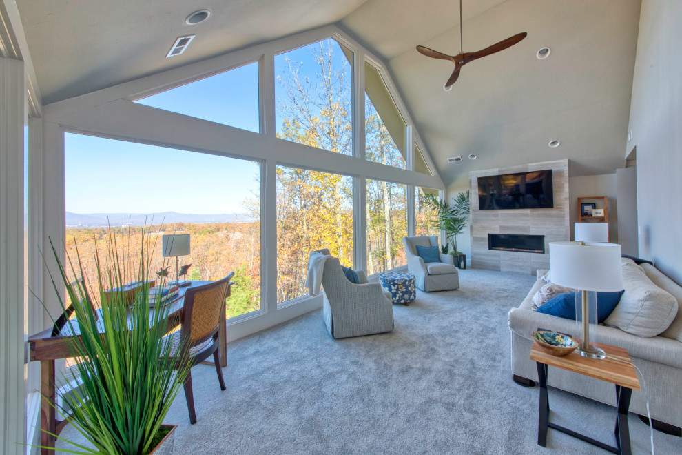 Mid-sized contemporary sunroom in Other with carpet, a standard fireplace, a tile fireplace surround and grey floor.