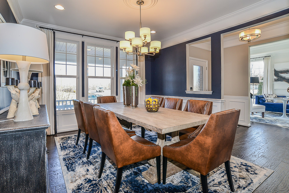 Inspiration for a traditional separate dining room in DC Metro with blue walls, dark hardwood floors, no fireplace and black floor.