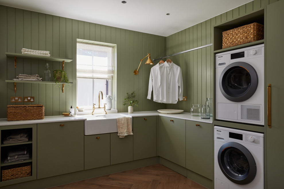 Photo of a transitional laundry room in London.
