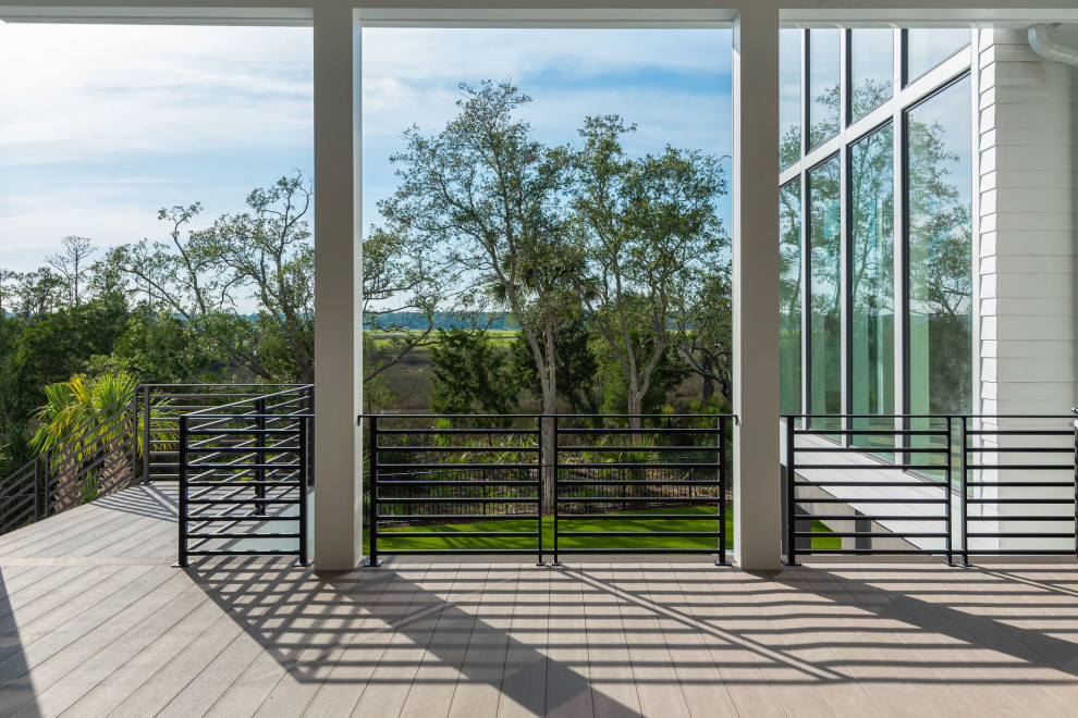 Outdoor kitchen deck - mid-sized modern backyard outdoor kitchen deck idea in Charleston with a roof extension