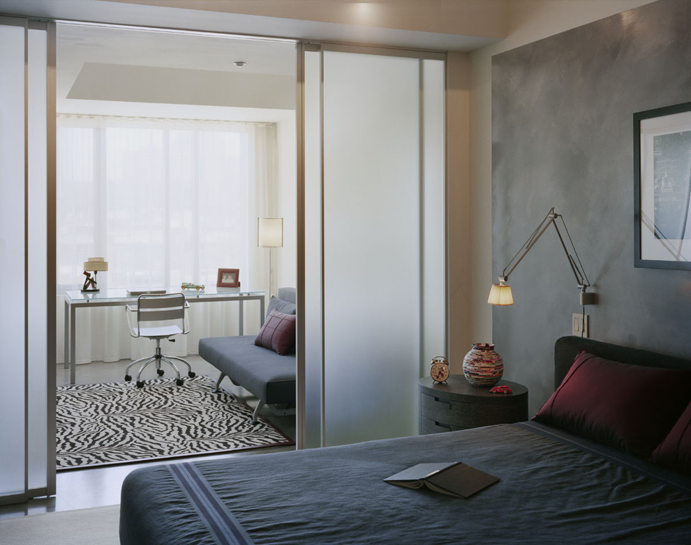 Inspiration for a modern bedroom in Boston with grey walls.